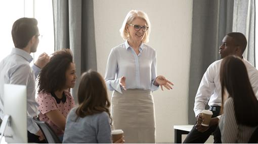 Middle-aged woman leading a team