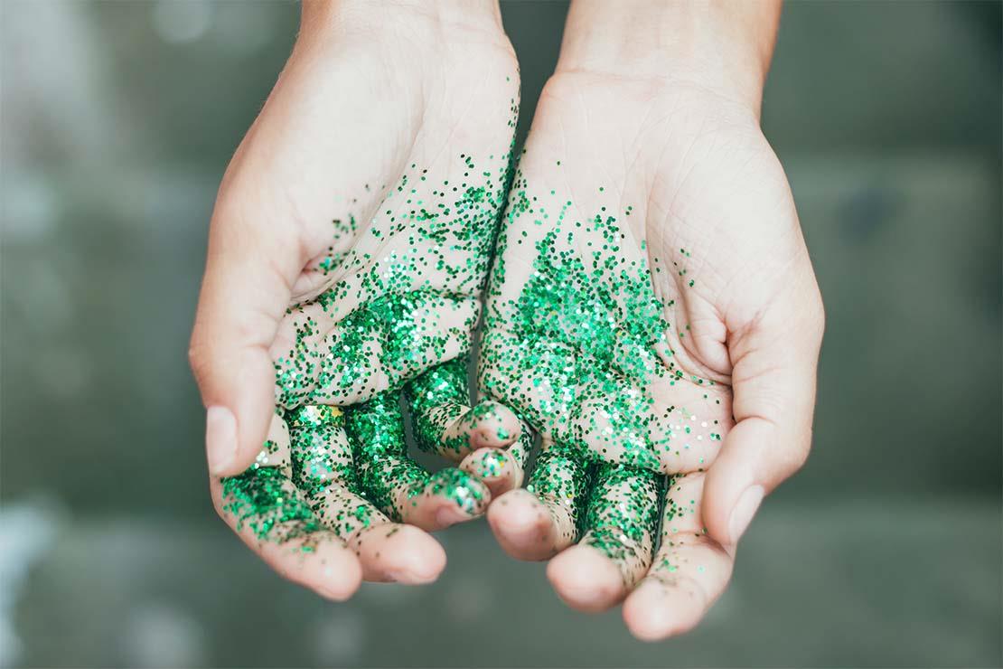Hands held out covered in glitter