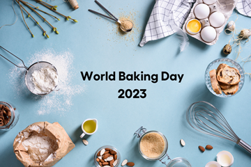 World baking day - ingredients around text