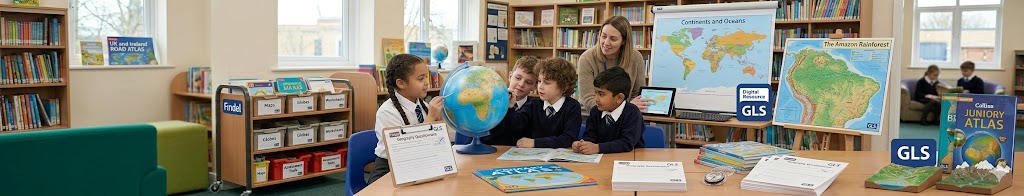 Primary school children exploring a classroom globe