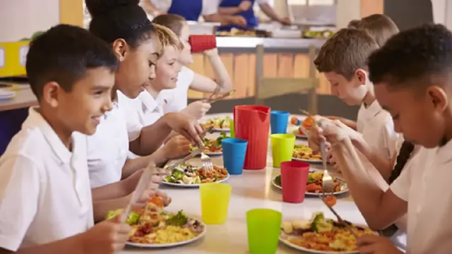 Students eating a healthy school meal